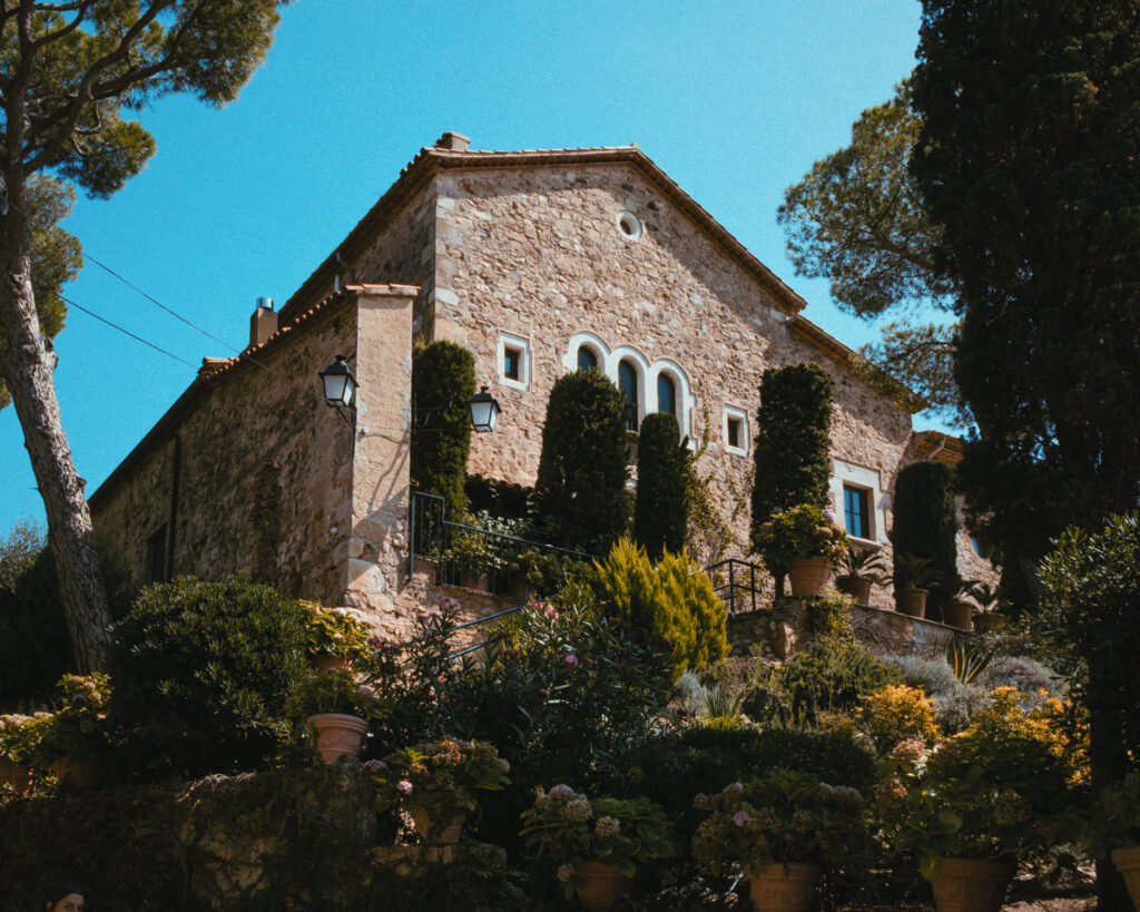 Exterior view of El Convent Blanes on the coastline