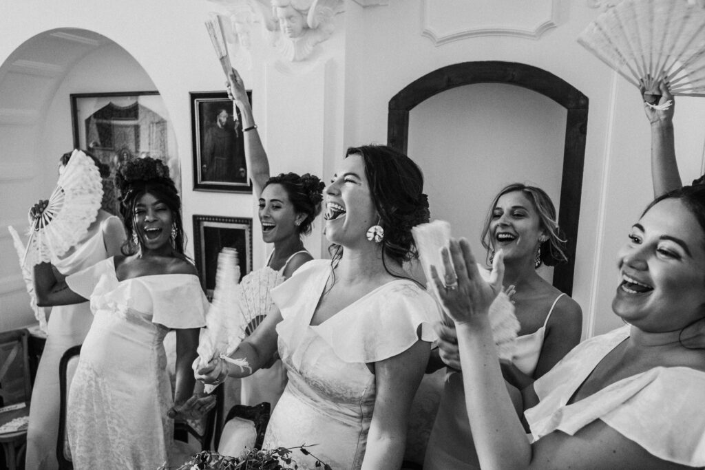 Guests standing close together during indoor ceremony at El Convent Blanes