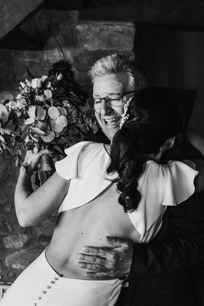 Bride hugging her father during at El Dalmau 