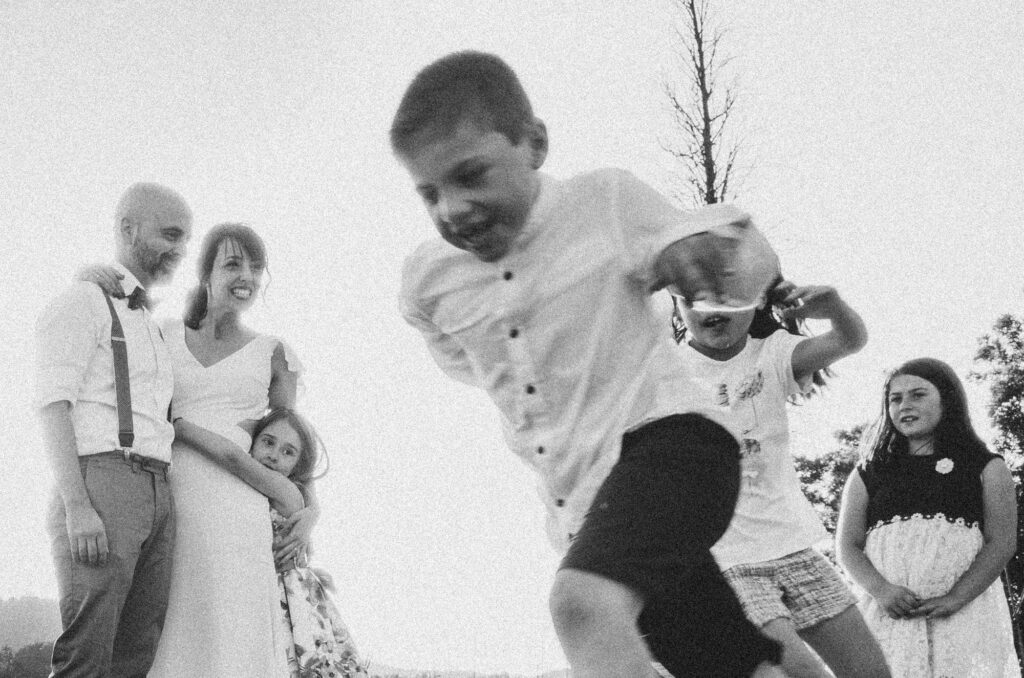 Children running around during an El Dalmau wedding