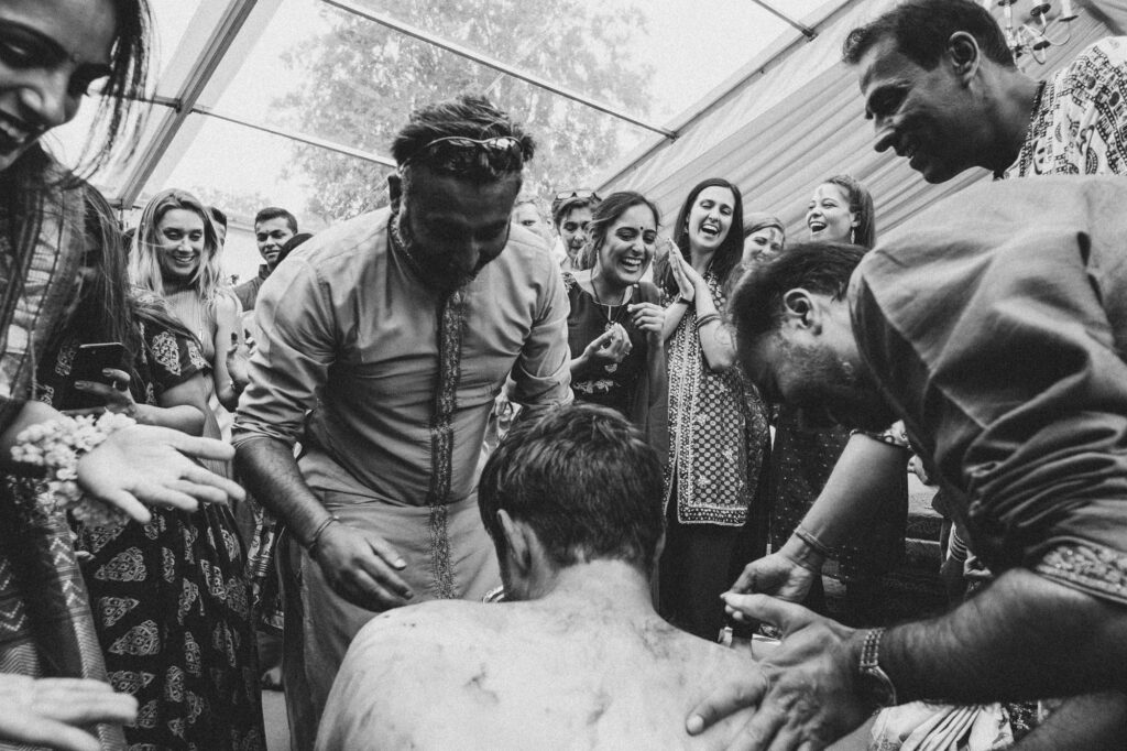 Groom during the haldi ceremony, Indian wedding photography in Hampshire