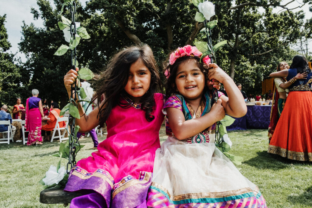 Two children during tIndian wedding photography in Hampshire