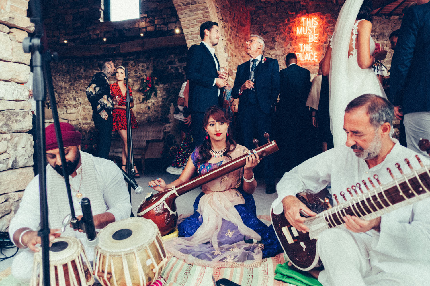 musicians playing during a wedding reception at This Must Be The Place
