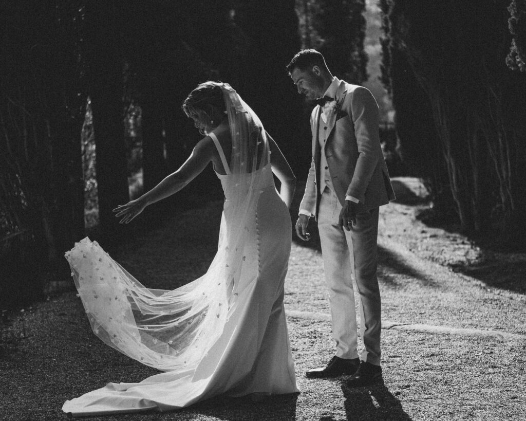 Bride and groom walking through courtyard at La Baronia Barcelona wedding venue