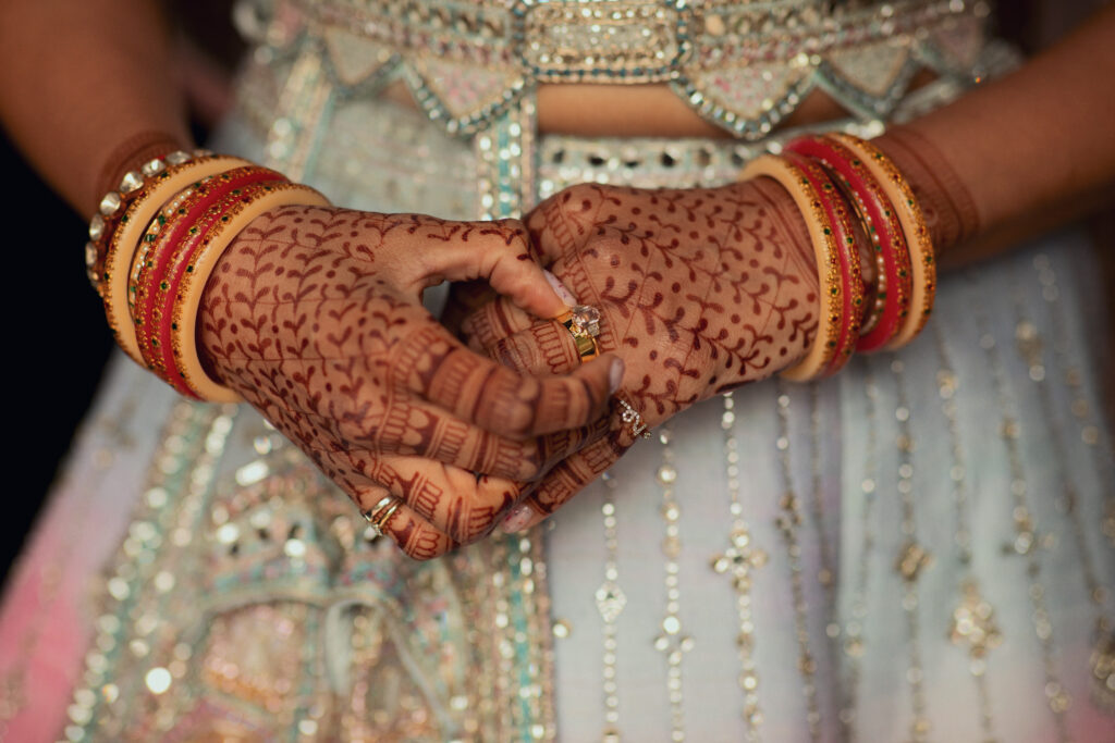 Bride hands with mehndi during Indian wedding in Barcelona