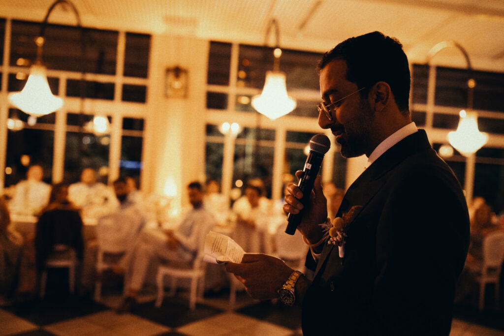 Groom speaking during wedding reception at Castell de Sant Marsal