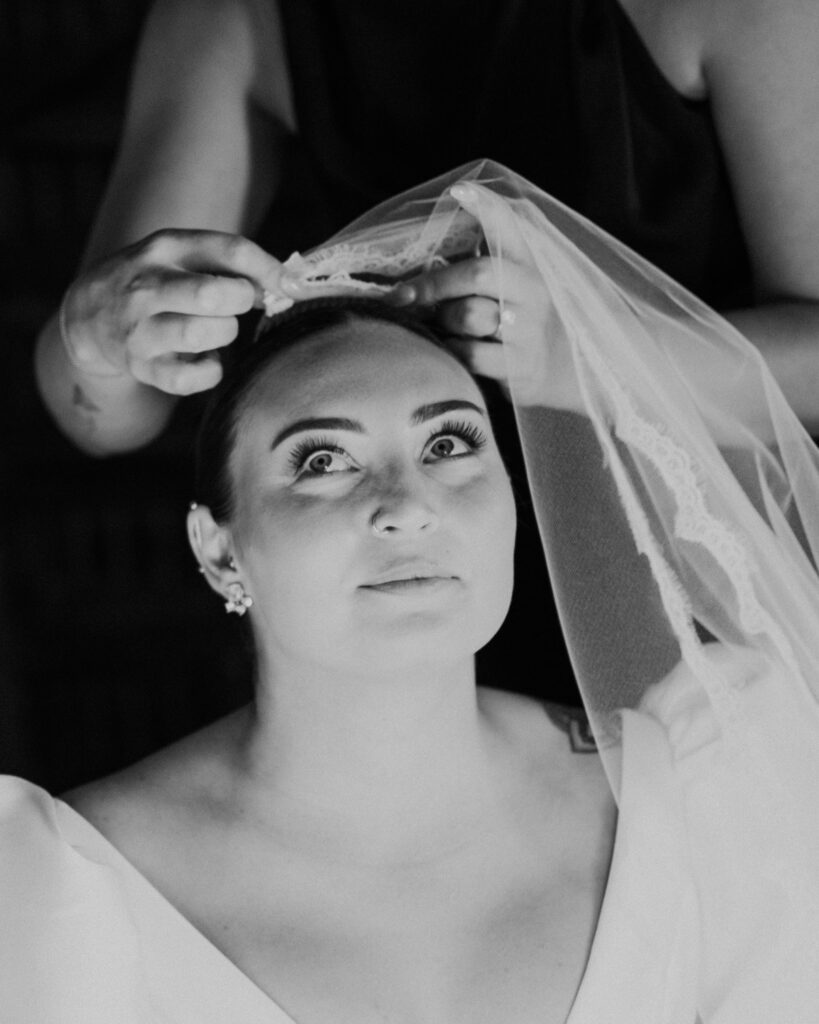 Bride veil being placed during destination wedding at Almiral de la Font