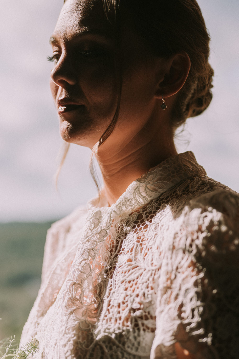Bride standing by a window before the wedding